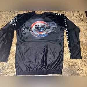 10th planet rash guard worn a couple times. Size large